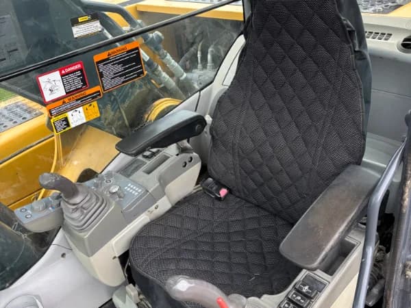 Operator station — seat, joysticks, and controls